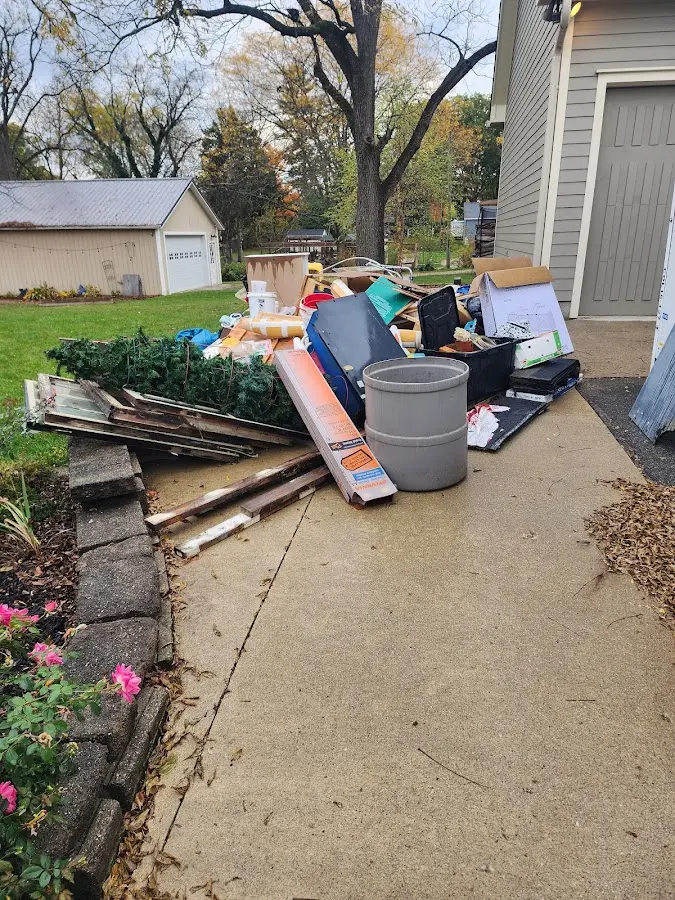 Dumpster being loaded with debris for 3 Yard Dumpster Rental in Secaucus
